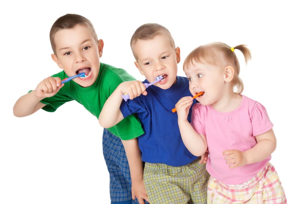 Kids brushing their teeth