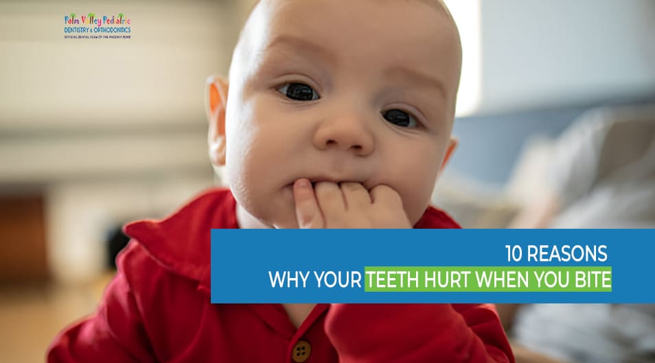Cute baby boy with fingers in mouth representing tooth pain when biting