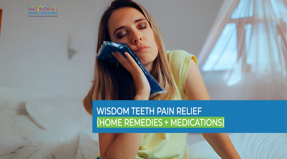 Woman with a toothache holding an ice bag for wisdom teeth pain relief